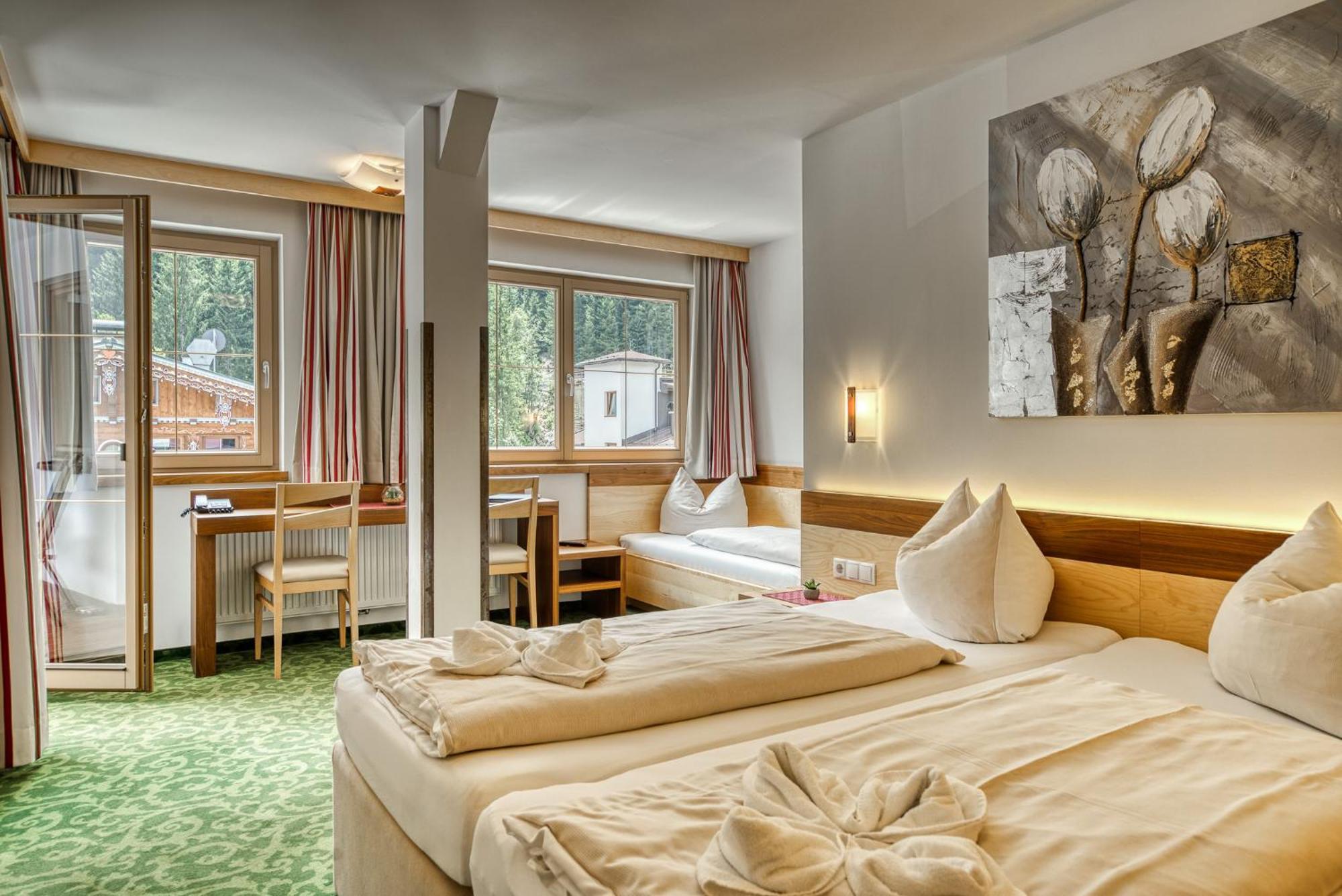Comfort Dreibettzimmer mit Balkon